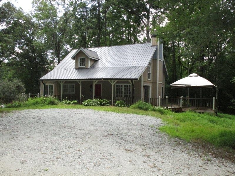 100 Running Deer Road, Unit 5 Cleveland, GA 30528 - Photo 1 of 1 a view of a house with a yard and sitting area