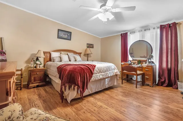 a bedroom with a bed and a dresser