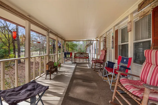 a bathroom with a sink a toilet and shower curtain