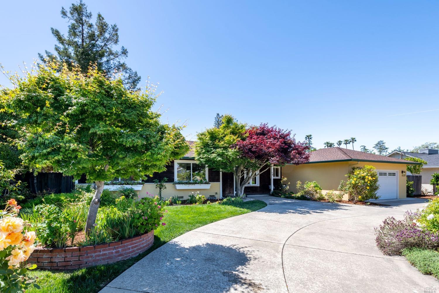 16 Loma Linda Road San Rafael, CA 94901 - Photo 1 of 46 a front view of a house with a yard and a garden