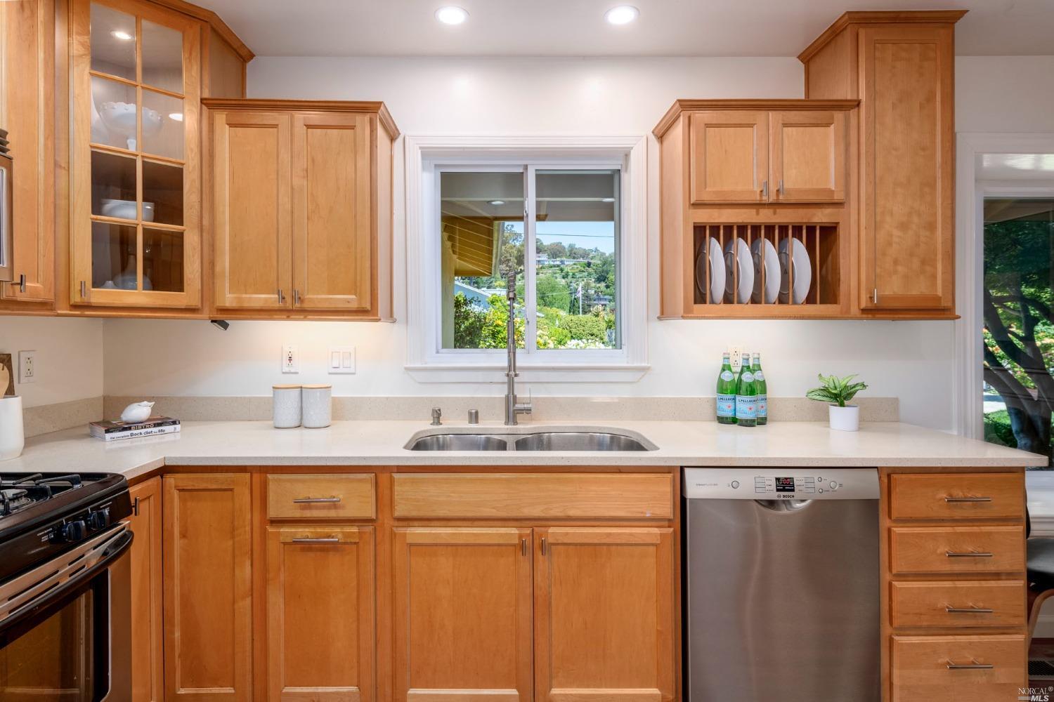 16 Loma Linda Road San Rafael, CA 94901 - Photo 15 of 46 a kitchen with granite countertop a sink cabinets stainless steel appliances and a window