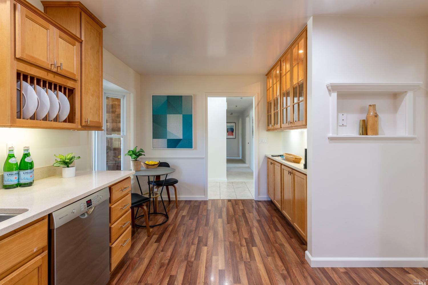 16 Loma Linda Road San Rafael, CA 94901 - Photo 16 of 46 a kitchen with a wooden floor and cabinets