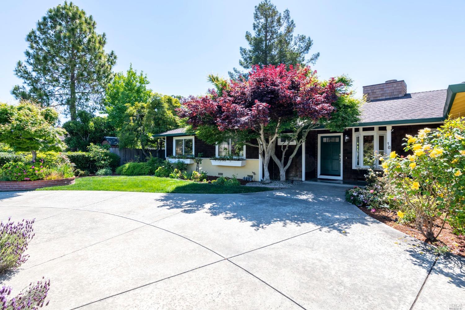 16 Loma Linda Road San Rafael, CA 94901 - Photo 2 of 46 a front view of a house with a yard and a garage