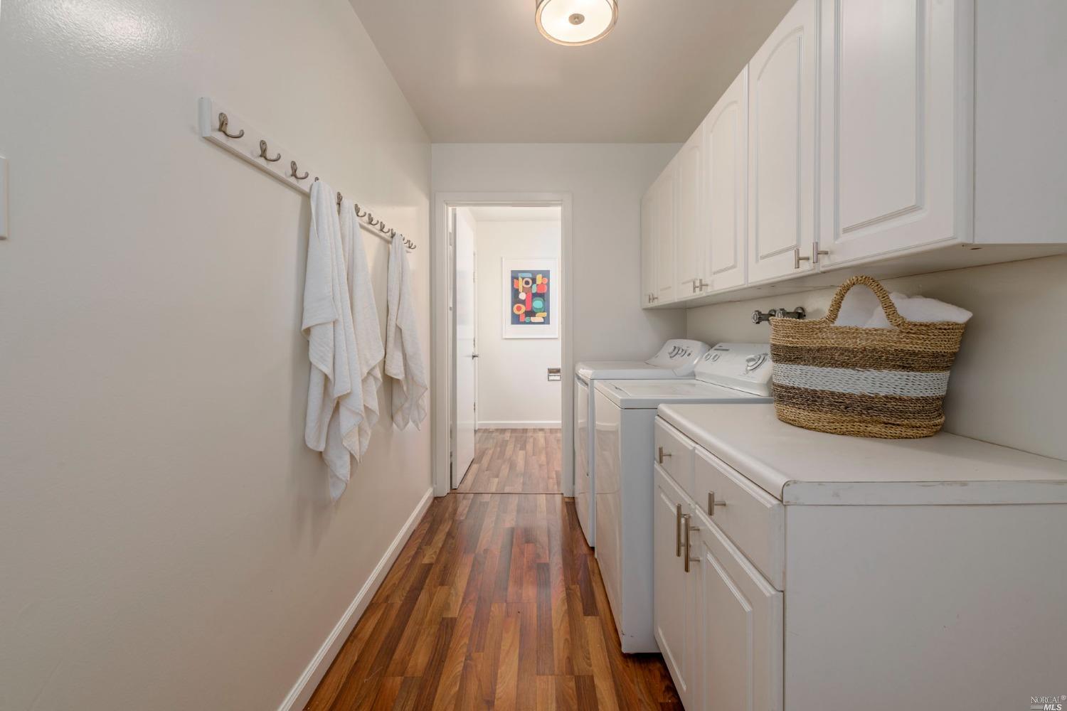 16 Loma Linda Road San Rafael, CA 94901 - Photo 21 of 46 a storage room with wooden floor washer and dryer