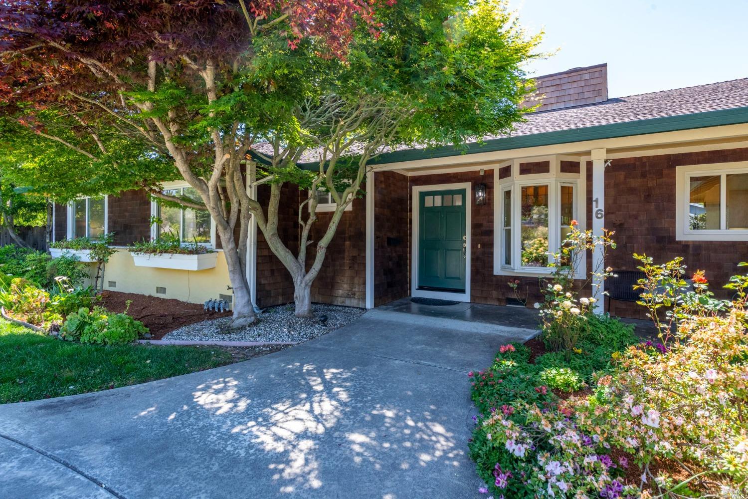 16 Loma Linda Road San Rafael, CA 94901 - Photo 3 of 46 a view of a house with backyard sitting area and garden