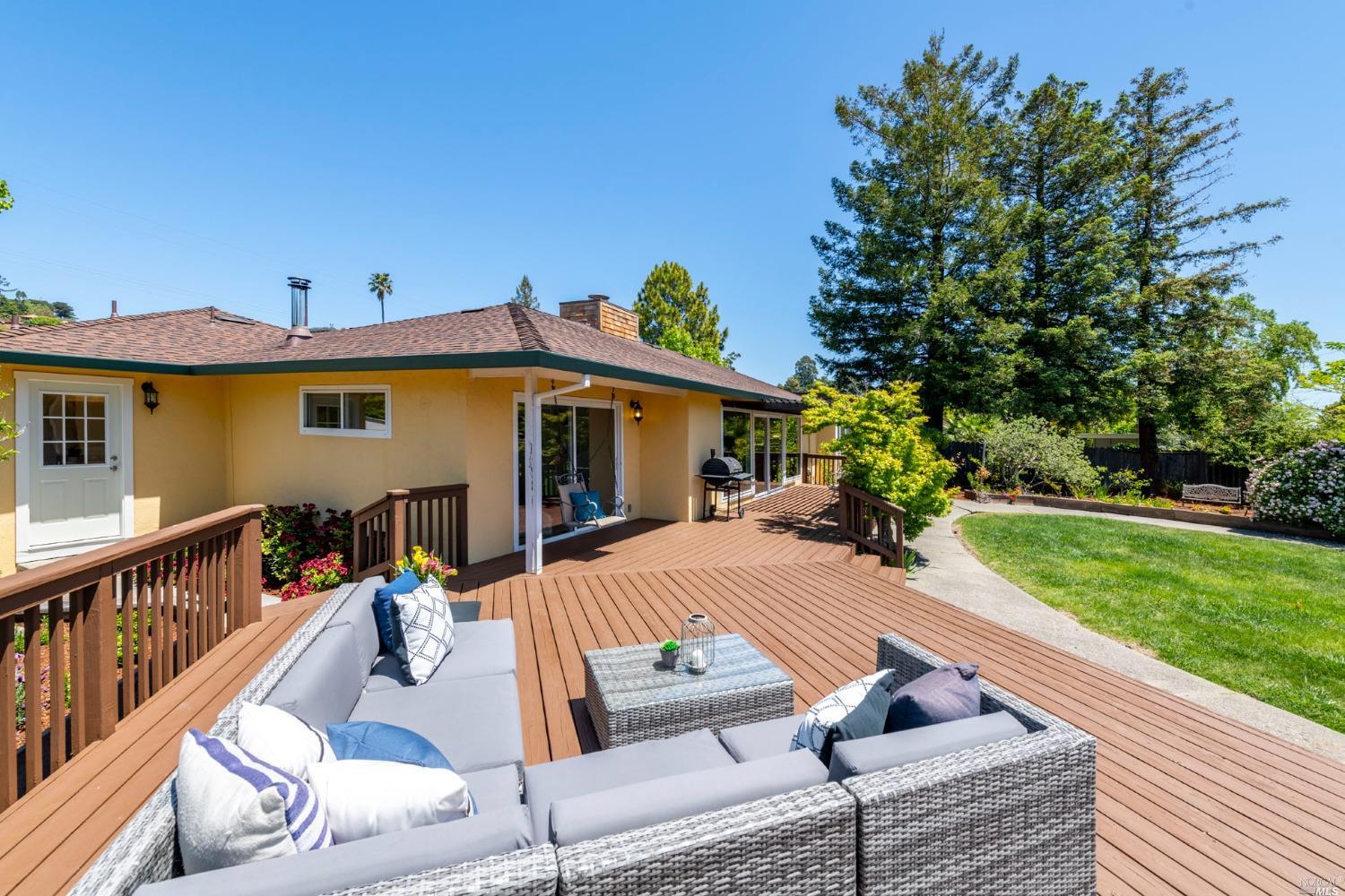16 Loma Linda Road San Rafael, CA 94901 - Photo 38 of 46 a view of a house with couches chairs and a yard