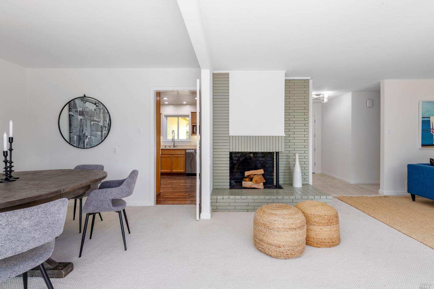16 Loma Linda Road San Rafael, CA 94901 - Photo 9 of 46 a living room with furniture and a fireplace