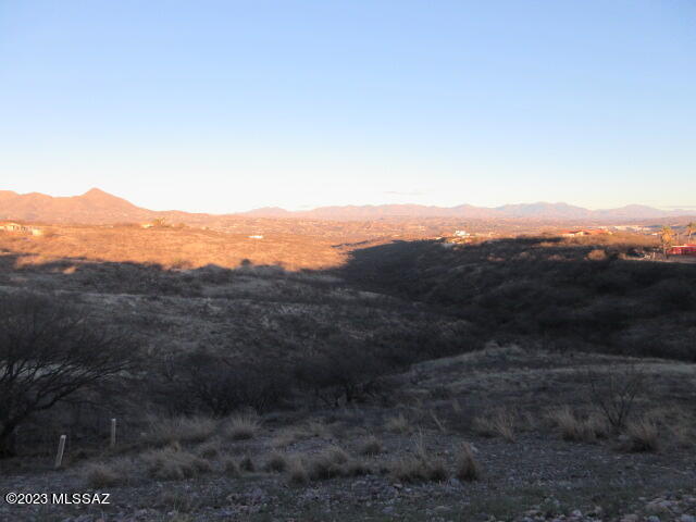 511 Camino Hombre De Oro Rio Rico, AZ 85648 - Photo 11 of 44 a view of a mountain range in a cloudy sky