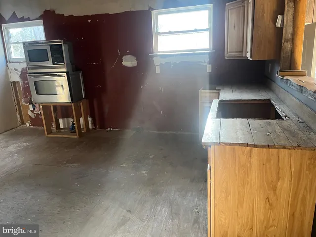 a view of a kitchen with a sink