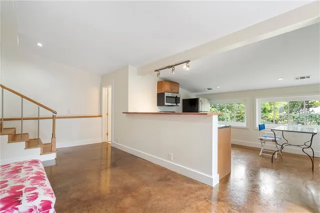 a bedroom with a bed and a shower