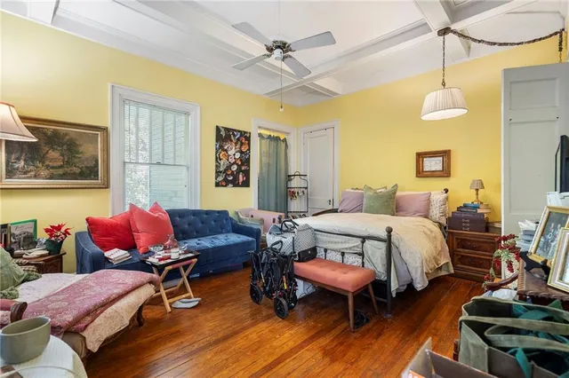 a kitchen with granite countertop a refrigerator and a stove top oven