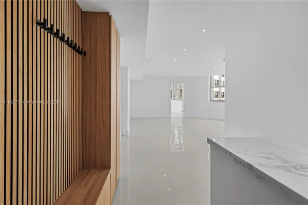 a view of hallway with wooden floor