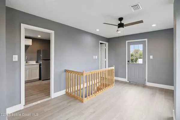 a view of a hallway with a bedroom