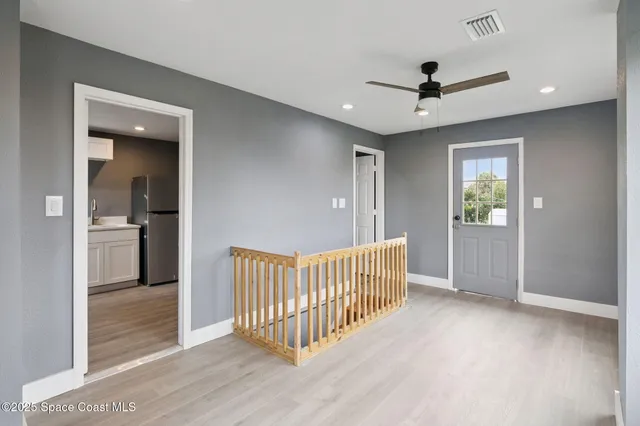 a view of a hallway with a bedroom