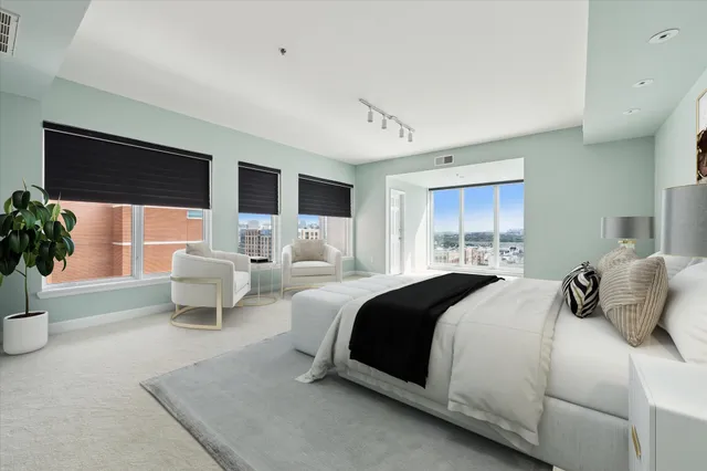 a bedroom with a bed and a couch