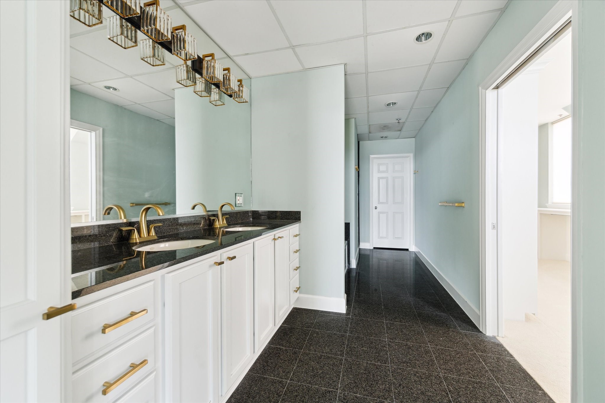 2520 Robinhood Street, Unit 1200 Houston, TX 77005 - Photo 15 of 29 a bathroom with a double vanity sink and mirror