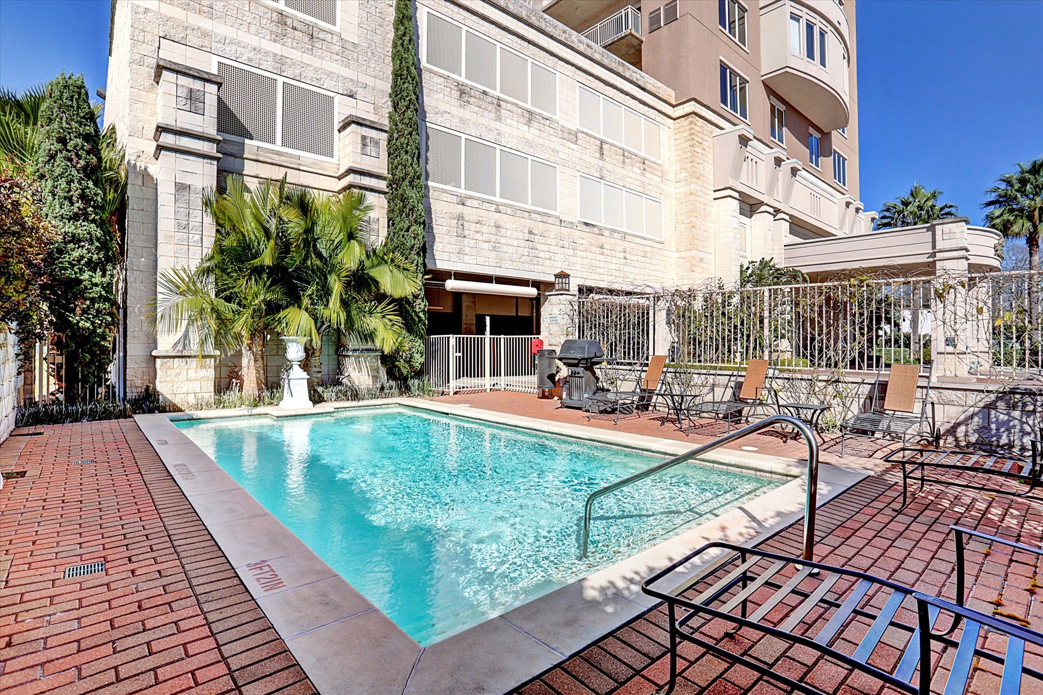 2520 Robinhood Street, Unit 1200 Houston, TX 77005 - Photo 26 of 29 a view of a swimming pool with outdoor seating