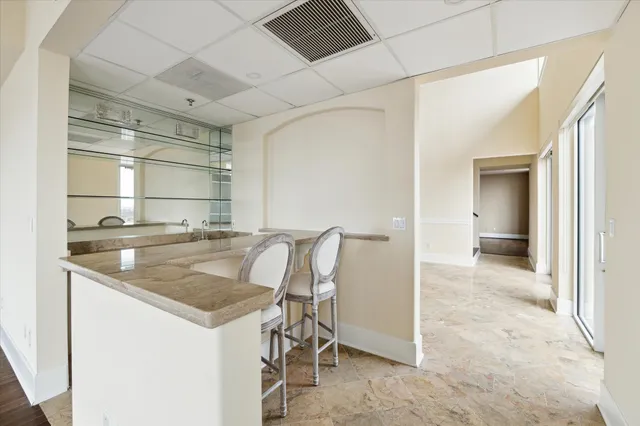 a kitchen with a table and chairs