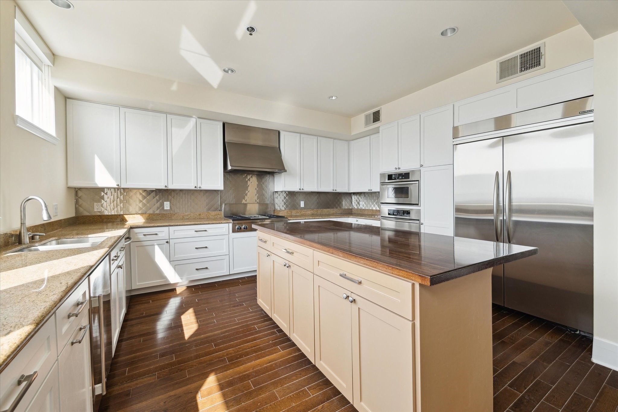 2520 Robinhood Street, Unit 1200 Houston, TX 77005 - Photo 8 of 29 a kitchen with a sink stove and refrigerator