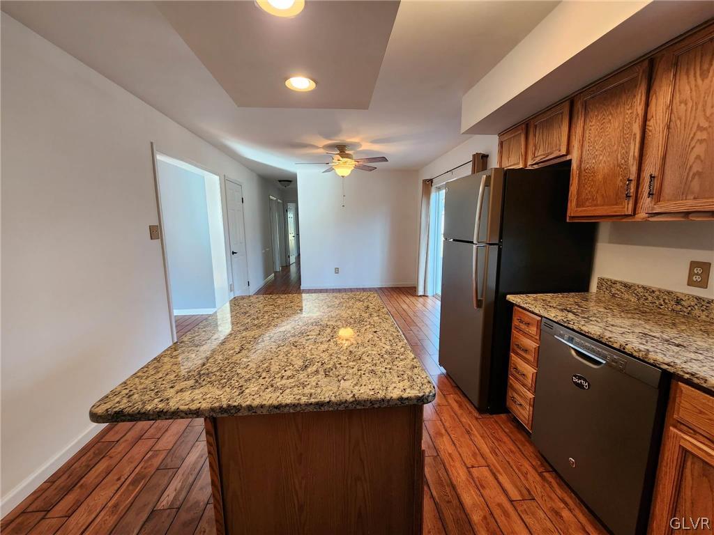 4824 Cedar Grove Road Bangor, PA 18013 - Photo 12 of 46 a kitchen with granite countertop stainless steel appliances a refrigerator counter space and a sink