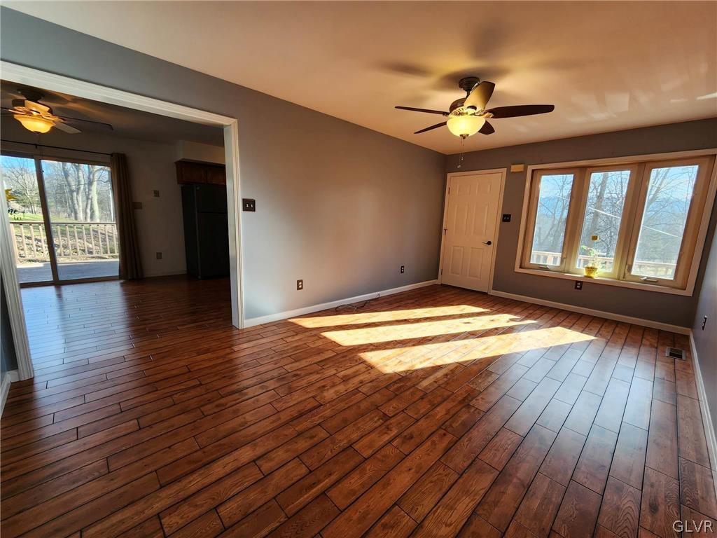 4824 Cedar Grove Road Bangor, PA 18013 - Photo 8 of 46 a view of a livingroom with wooden floor and a ceiling fan