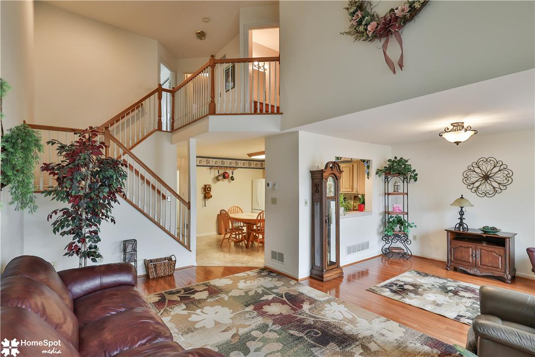 507 Howertown Road Northampton, PA 18067 - Photo 15 of 46 Hardwood floors and a multi-level staircase define this welcoming living area.