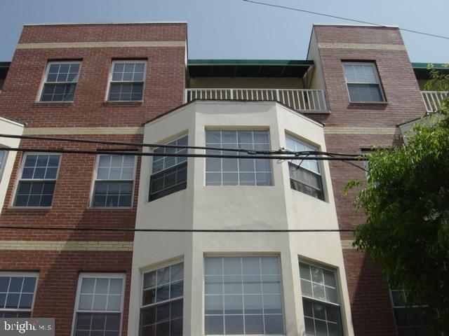 1121 Hamilton Street, Unit A Philadelphia, PA 19123 - Photo 5 of 11 a view of a building with a door