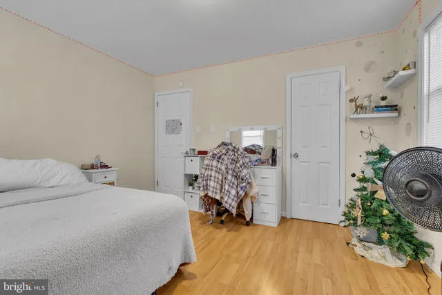 a bed room with a bed and a chair