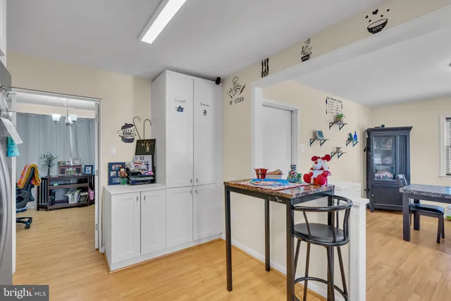 a view of a livingroom with furniture a table and chair