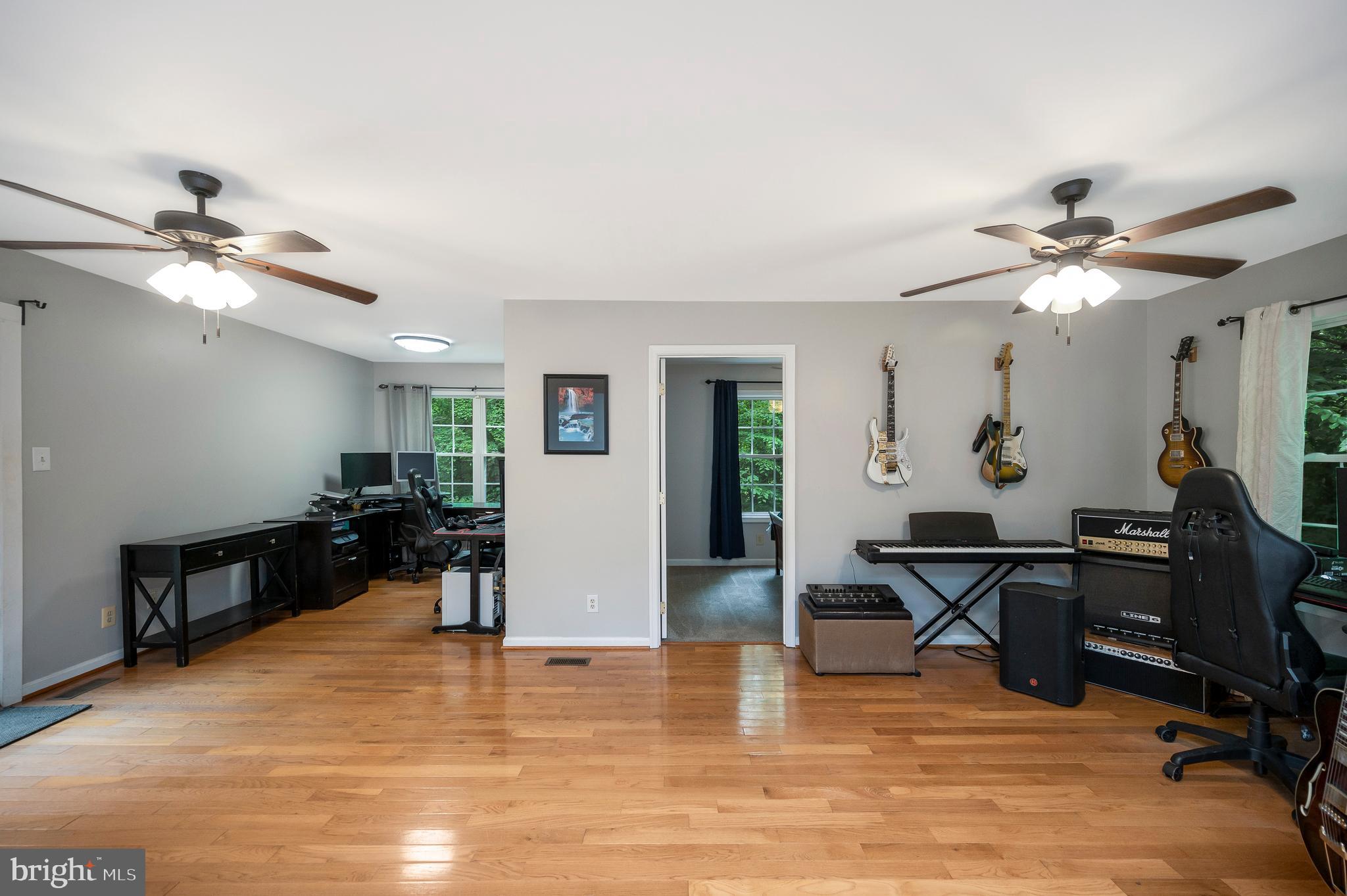 679 Cropp Road Fredericksburg, VA 22406 - Photo 22 of 39 a view of a livingroom with workspace and a window