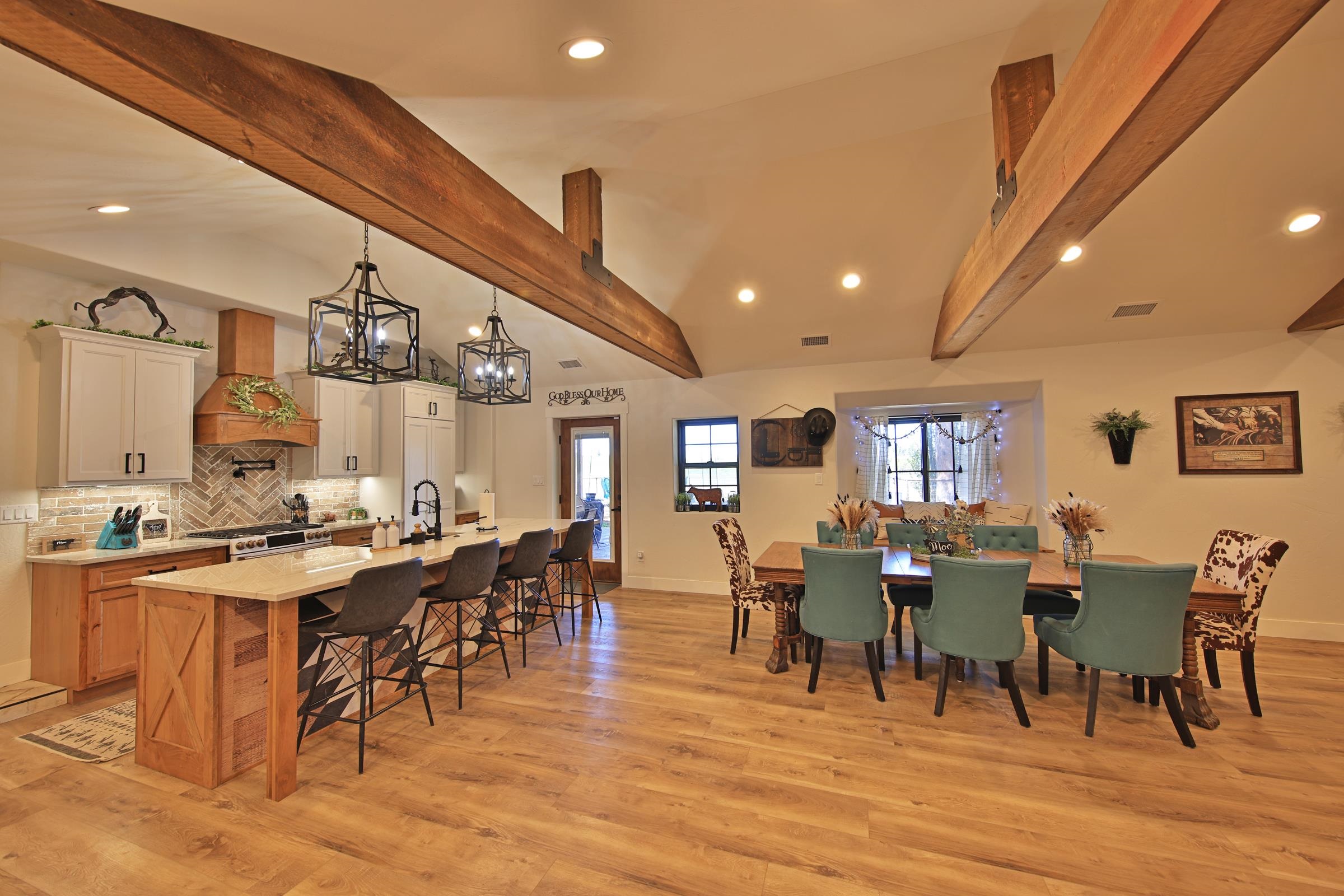 58749 Oe Road Collbran, CO 81624 - Photo 10 of 42 a view of a dining area with furniture window and wooden floor