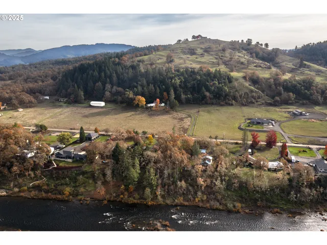 a view of a town with mountains in the background