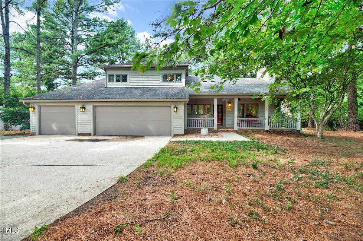 11001 Honeycutt Road Raleigh, NC 27614 - Photo 1 of 36 a front view of a house with yard and tree