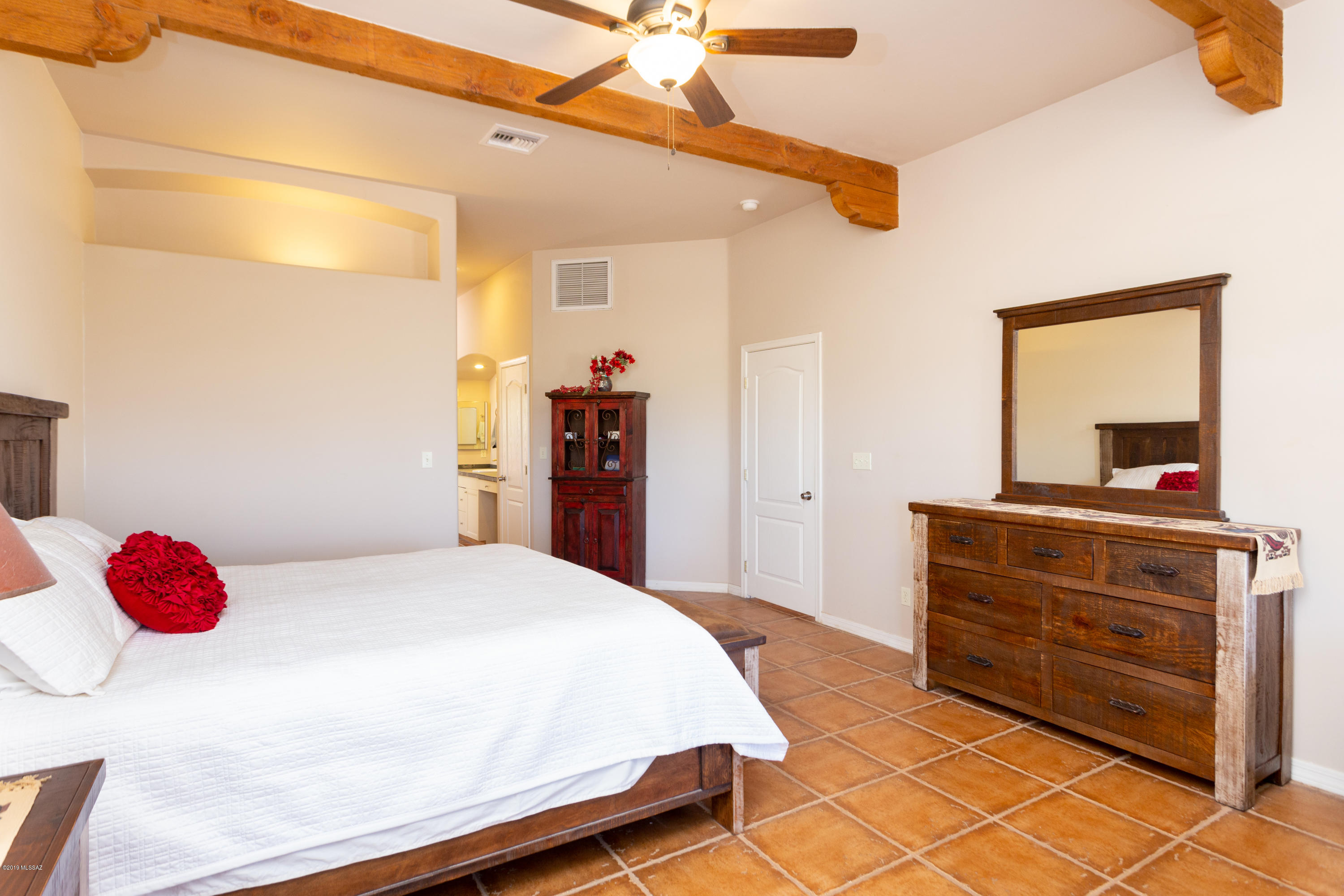 1748 Avenida Pastor Rio Rico, AZ 85648 - Photo 14 of 28 a bedroom with a bed and a dresser