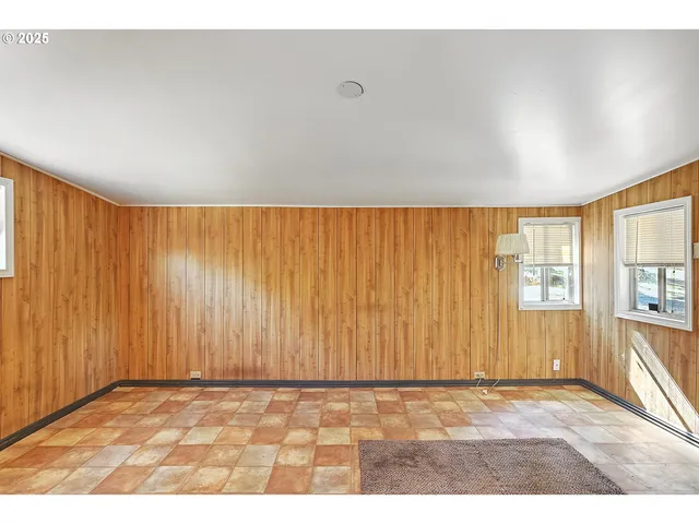 a kitchen with stainless steel appliances granite countertop a sink and a stove