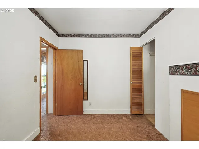 a view of a bedroom with a window