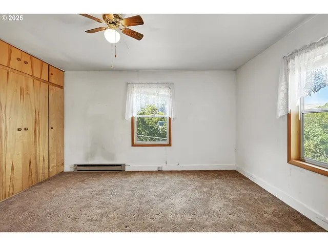 a balcony with wooden floor and city view