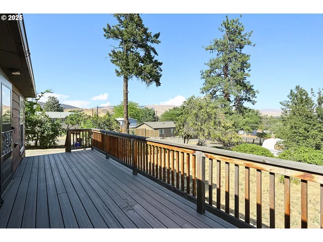 a view of a house with a snow in the yard