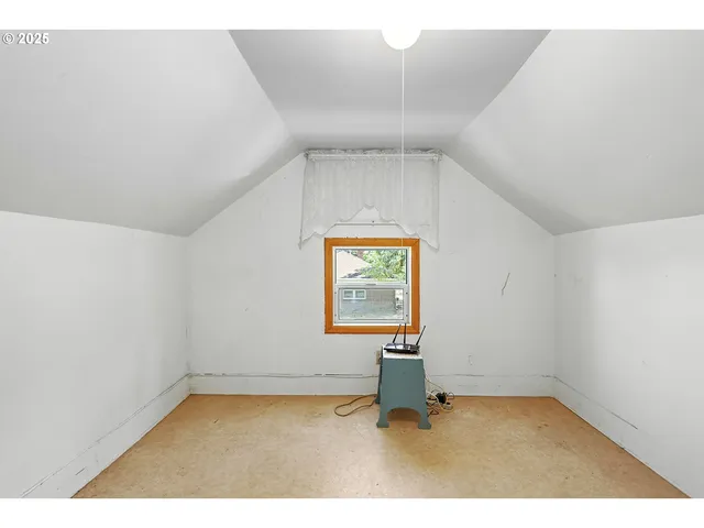 a view of an empty room and window