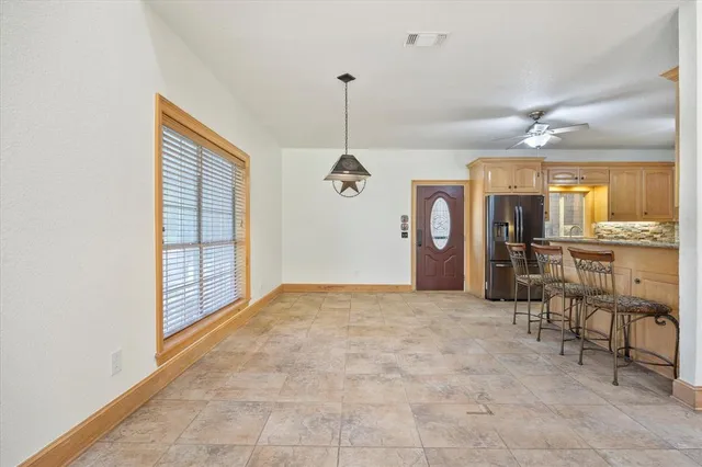 a view of a livingroom with furniture and windows