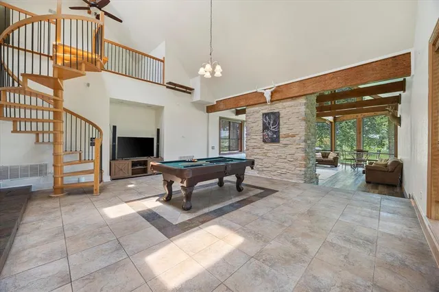 a view of a livingroom with furniture and workspace
