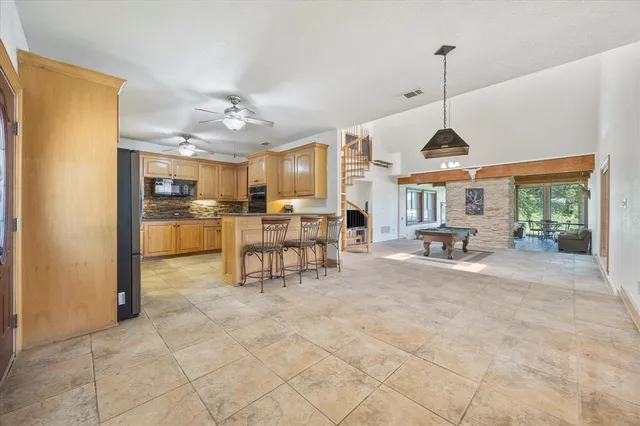 a view of a kitchen with furniture and a window