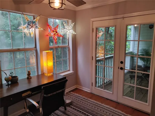 a view of a room that has a bed and a window