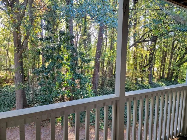 a view of a forest from balcony