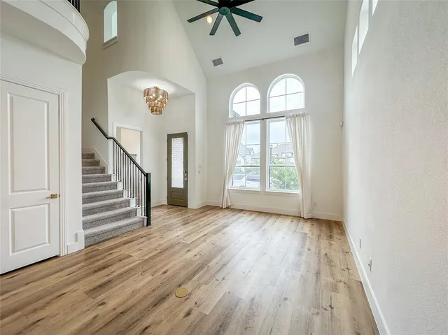 a living room with furniture a fireplace and white walls