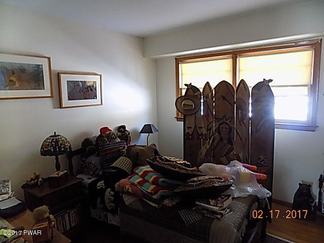 136 Beech Road Dingmans Ferry, PA 18328 - Photo 13 of 13 a room with gym equipment and a large window