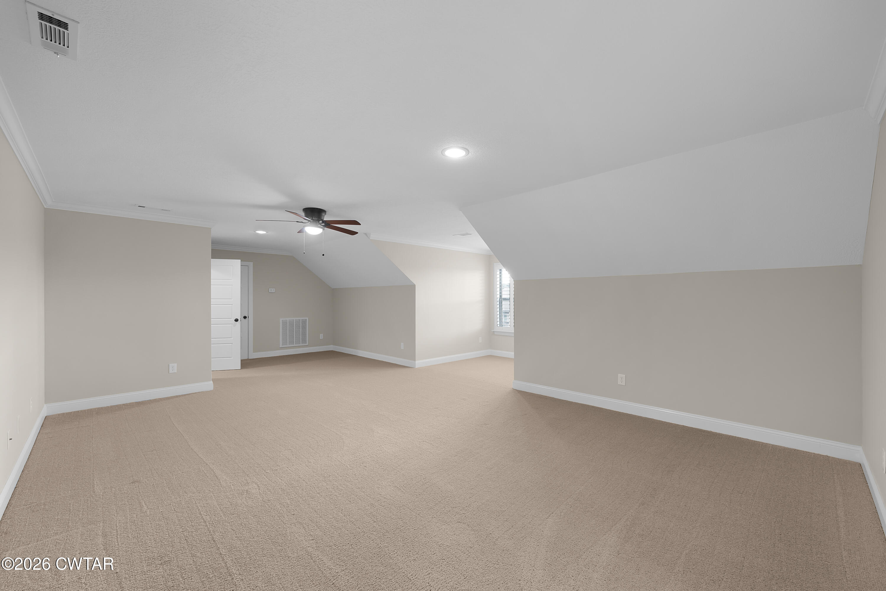 34 Cheddleton Cove Jackson, TN 38305 - Photo 22 of 32 an empty room with a ceiling fan and window