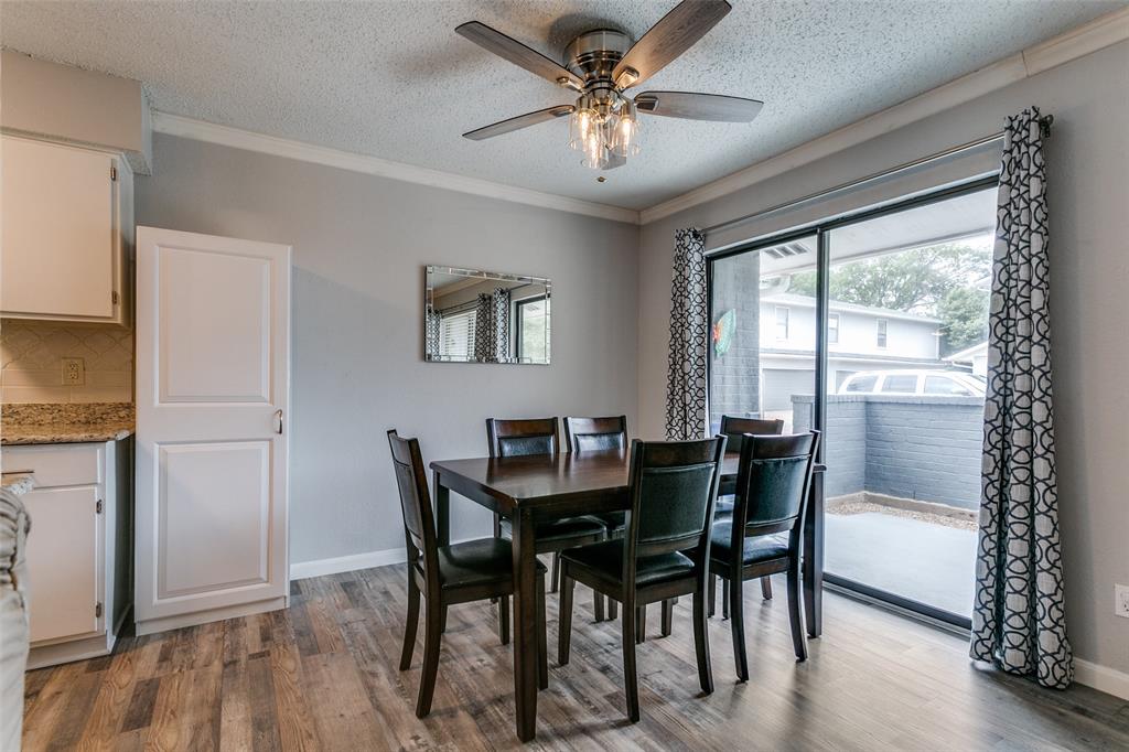 649 Timberline Drive Hurst, TX 76053 - Photo 11 of 29 a view of a dining room with furniture window and wooden floor
