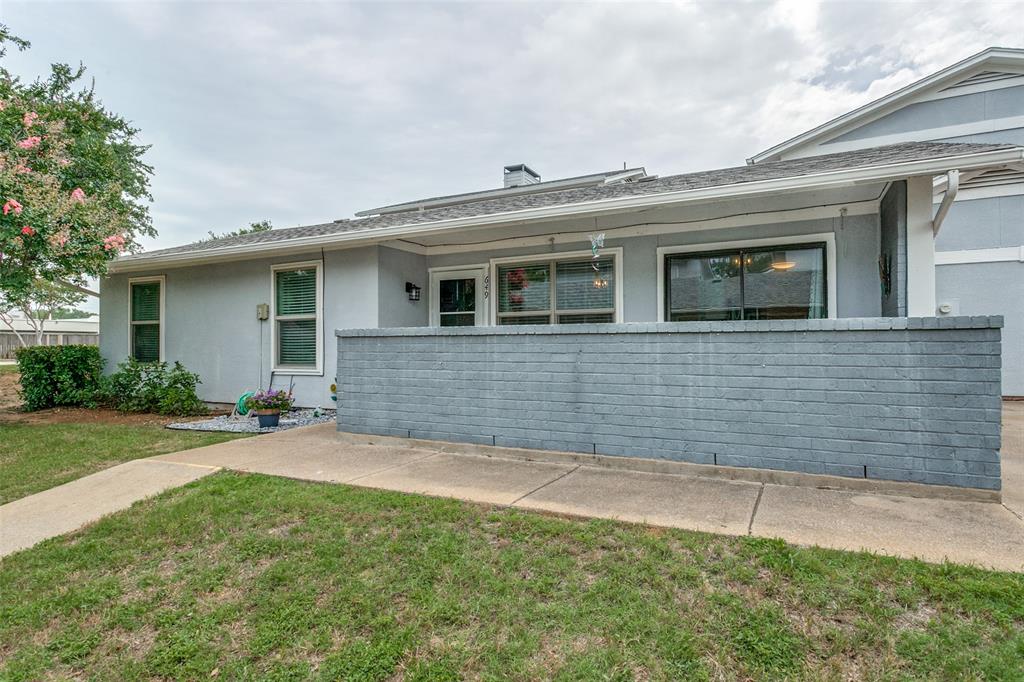 649 Timberline Drive Hurst, TX 76053 - Photo 2 of 29 a front view of a house with a yard and garage