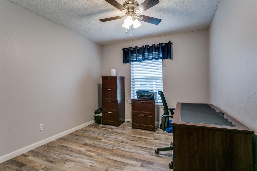 649 Timberline Drive Hurst, TX 76053 - Photo 22 of 29 a view of workspace with furniture and cabinet